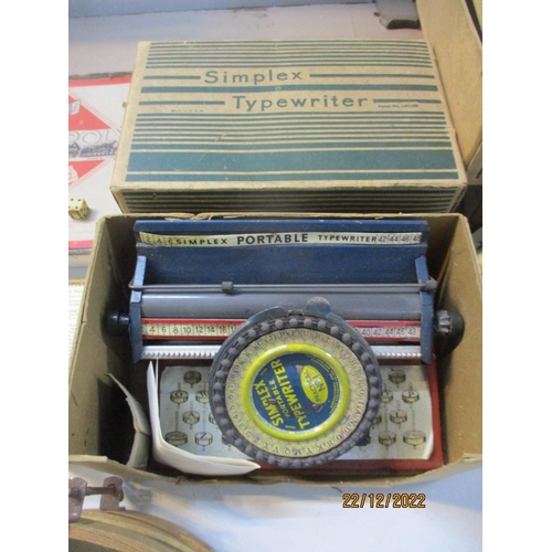 572 - A selection of games and toys to include a boxed tin plate Simplex portable typewriter, practical No... 