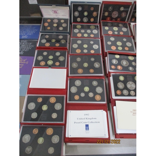 581 - A collection of Elizabeth II proof coin sets from 1970 x 2 to 2011, a near-unbroken series (year 200... 