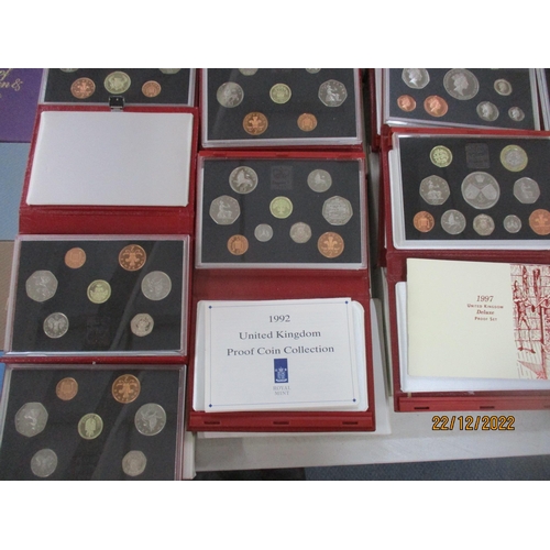 581 - A collection of Elizabeth II proof coin sets from 1970 x 2 to 2011, a near-unbroken series (year 200... 