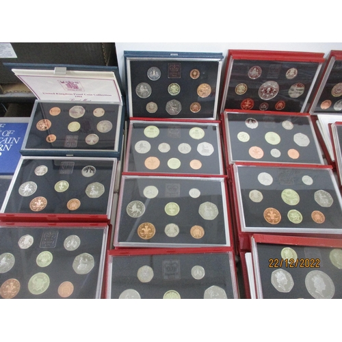 581 - A collection of Elizabeth II proof coin sets from 1970 x 2 to 2011, a near-unbroken series (year 200... 