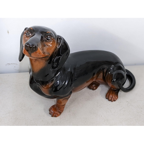 596 - Two Beswick dog models of Dachshunds, 26cm h x 34.5cm w
Location: RWF