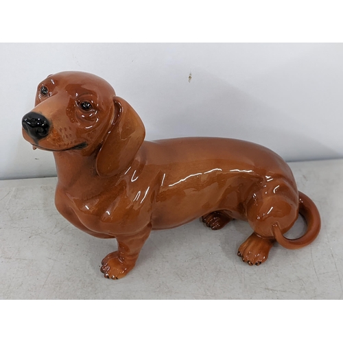 596 - Two Beswick dog models of Dachshunds, 26cm h x 34.5cm w
Location: RWF