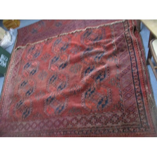 71 - A Persian hand woven red ground rug decorated with elephant gulls, multiguard border and tasselled e... 