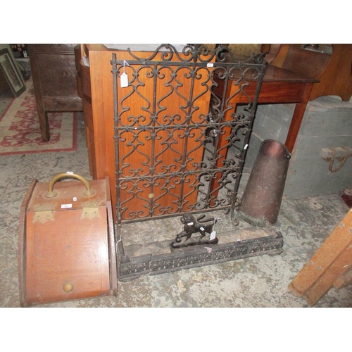 73 - A group of fireside furniture to include a cast iron fire guard, fire fender and door stop in the fo... 