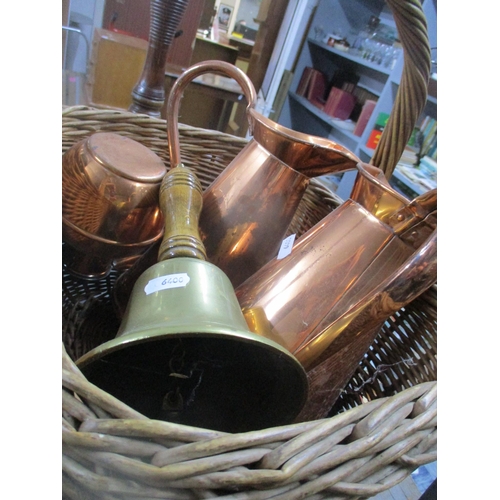 92 - A mixed lot of copper and brassware to include hand bells, various thermos flasks, a leather holder ... 