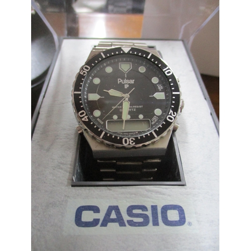 98 - A modern quartz wristwatch comprising a branded Seiko automatic navigator timer in a Pulsar box, a L... 