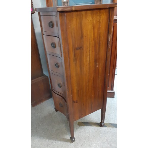 649 - Circa 1900, a serpentine fronted chest of five graduated drawers on square tapering legs with spade ... 