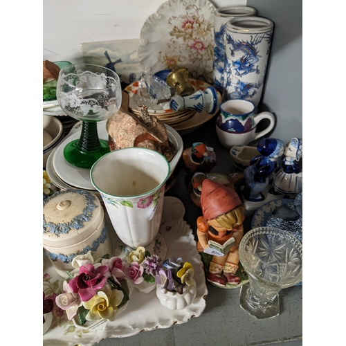 37 - Decorative ceramics and glassware to include Delft model flowers, a pair of Chinese vases, tableware... 