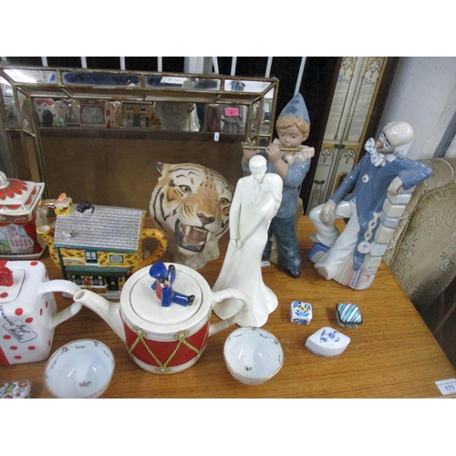 107 - A mixed lot of ceramics to include various novelty teapots, Beswick vases and a basket, Cascades Clo... 