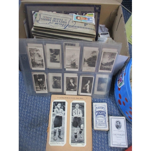 119 - A collection of cigarette and tea cards, some mounted in an album, booklets, or glazed frames, other... 