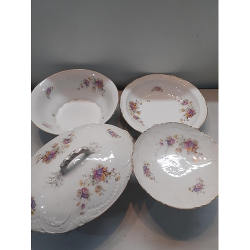 164 - A mid 20th century large dinner service in the French style having a white ground with floral sprays... 