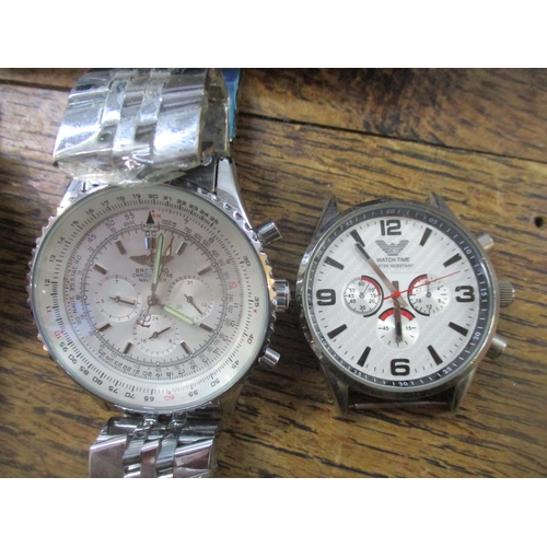 53 - A boxed digital video watch, a Watch Time watch, an Eton quartz watch, a copy of a Breitling Chronom... 