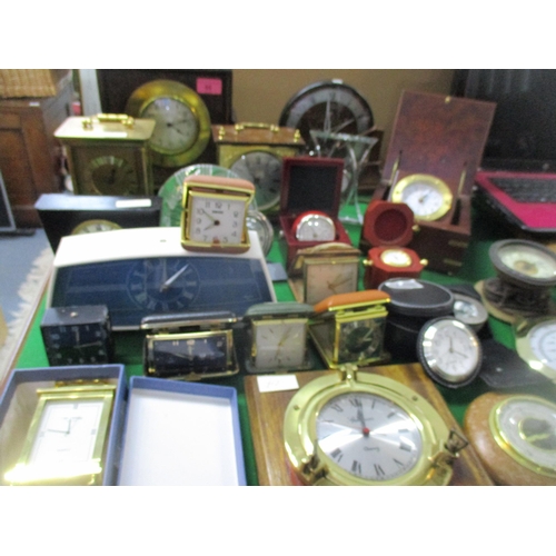 55 - A mixed lot of mantel clocks, dressing table travel clocks, a William Widdop quartz carriage clock, ... 