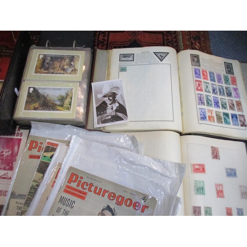 67 - A mixed lot of ephemera and stamps to include The Meteor and Swift Sure albums of world stamps, vari... 