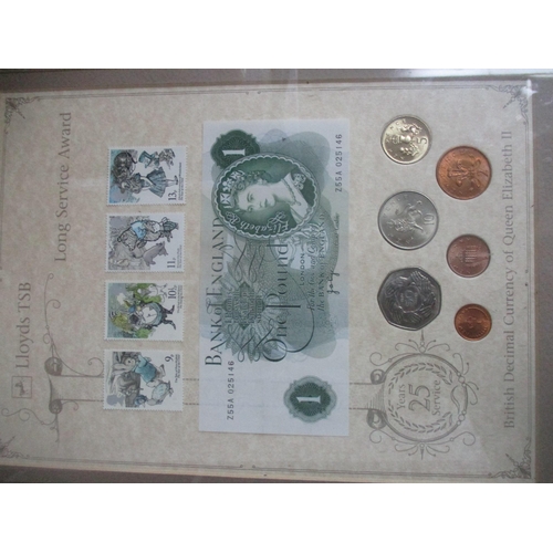 75 - A group of framed and glazed displays of British coins, banknotes, and stamps to include Ancient to ... 