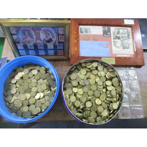 97 - A selection of British coinage to include two tins of brass threepence pieces, an album of European ... 