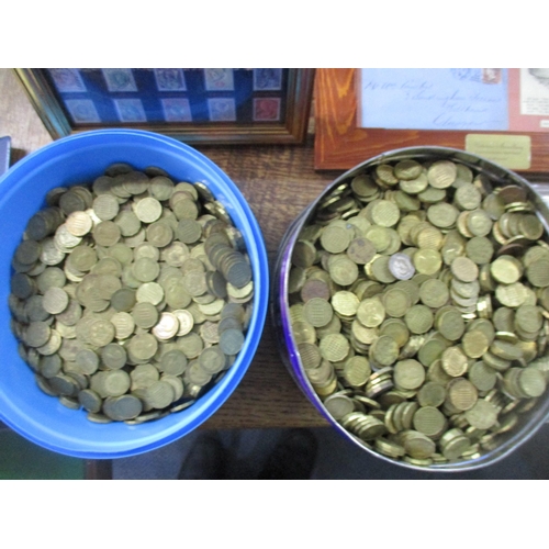 97 - A selection of British coinage to include two tins of brass threepence pieces, an album of European ... 