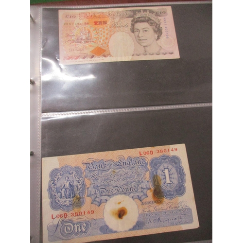 98 - An album of British banknotes to include 10-shilling notes, £1 notes, various dates, £5 and £10 note... 