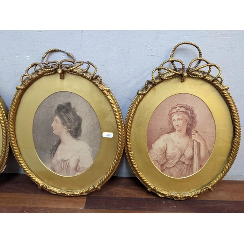 143 - Three 19th century portrait prints of ladies, in oval gilt frames with ribbon surmounts, 37cm h x 28... 