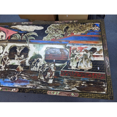 16 - A vintage Chinese chinoiserie rectangular shaped coffee table decorated with figures, trees and pond... 