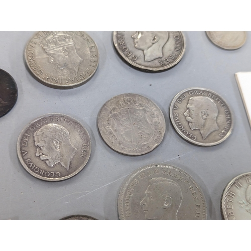 172 - A group of British coinage to include Victorian and later silver coinage, 1827 half penny, a 1817 co... 