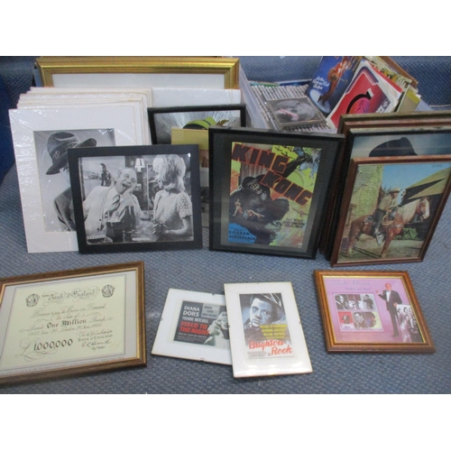 124 - A mixed collection of CDs, DVDs, 45rpm singles records, mounted, and framed and glazed Disney pictur... 