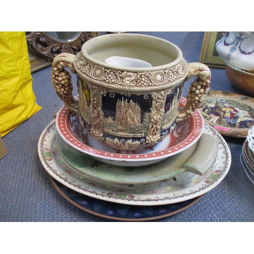 125 - A mixed lot of ceramic plates, wall chargers, wash bowl and jug, chamber pots, and other items to in... 