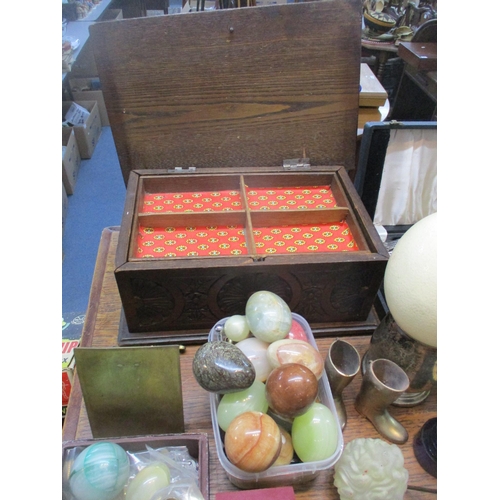 126 - A mixed lot to include a carved wooden work box, onyx and stone eggs, Georgian papiermache snuff box... 