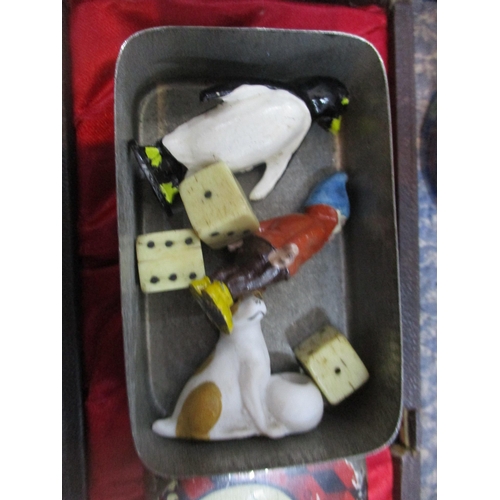 44 - A miscellaneous lot to include Christmas cake decorations, one depicting Felix the Cat, bone dice, c... 