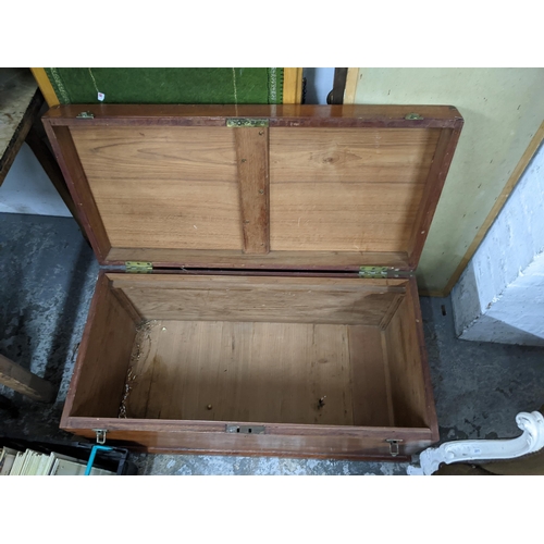 41 - A 20th century hardwood chest with brass catches Location: