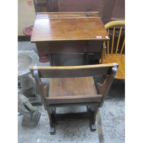 488 - An early 20th century school desk with hinged lid and chair Location:G