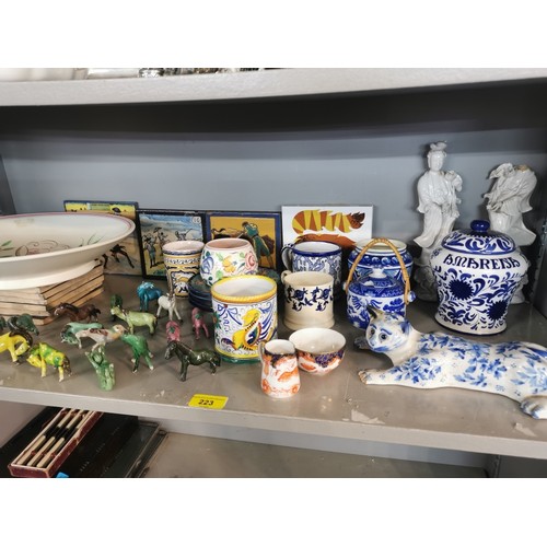 223 - A collection of mixed ceramics to include a blue and white model of a cat a/f, a large Poole pottery... 