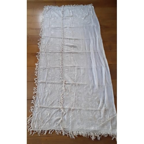 266 - A late 19th/early 20th Century cream double layered silk crinoline shawl heavily hand embroidered in... 