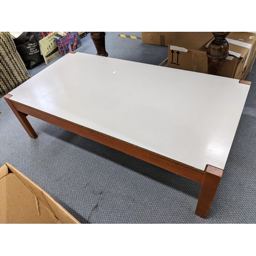 264 - A mid 20th century Parker Knoll rectangular topped coffee table 32cm h x 110cm w
Location: ROS