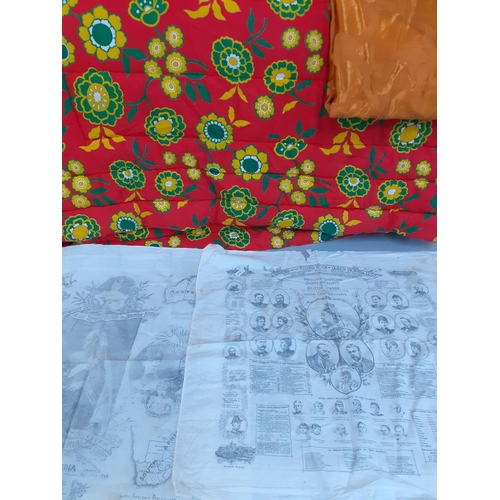 274 - A quantity of vintage fabrics to include a 1970's red quilted eiderdown 77