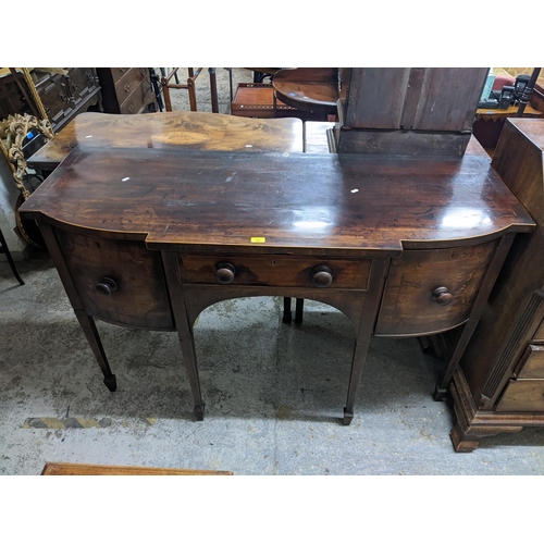 102 - A George III mahogany sideboard with two drawers and a door, on square tapered legs
Location: G