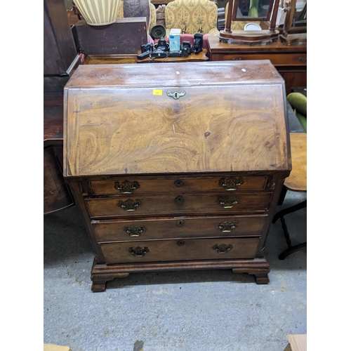 105 - A George III mahogany bureau with four graduated long draw.
Location: G