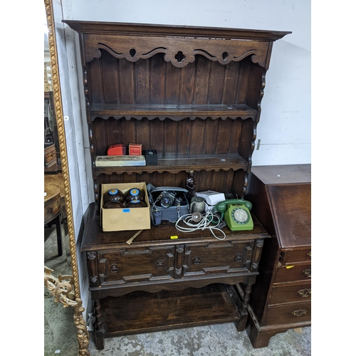 107 - An early 20th century oak dresser with two draws, over a shelf.
Location: G