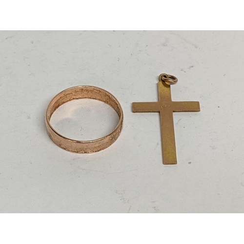 111 - A 9ct gold wedding band together with a 9ct gold cross, 3.7g
Location: CAB5