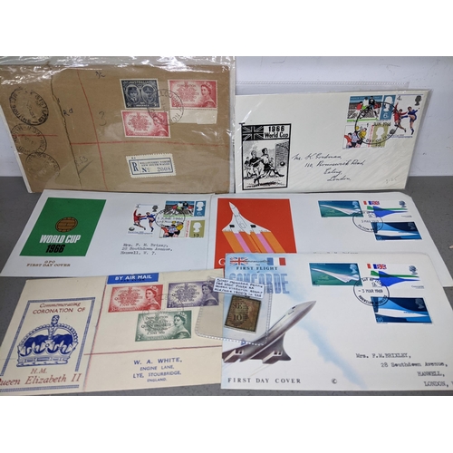 116 - A small selection of stamps and first day covers to include a Victorian silver mounted penny red sta... 