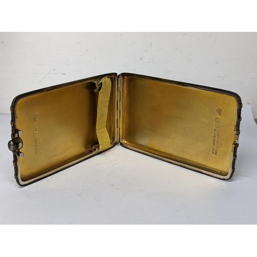 122 - An Edwardian silver cigarette case by Goldsmiths Company with yellow metal banding, hallmarked Londo... 