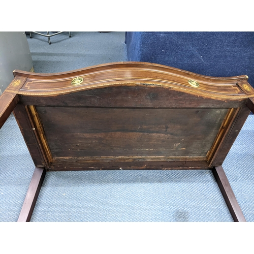 129 - A George III mahogany serpentine fronted side table having parquetry inlaid, single drawer and taper... 