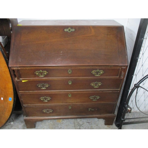 132 - A Georgian mahogany bureau of one short and three long graduated drawers, fall flap revealing a pige... 