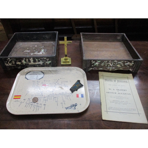 135 - Two Chinese inlaid padouk wooden trays, a brass cross, and a Pirates of Penzance theatre programme L... 