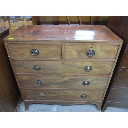 136 - A late George III mahogany flat fronted chest of two short and three long graduated drawers on splay... 