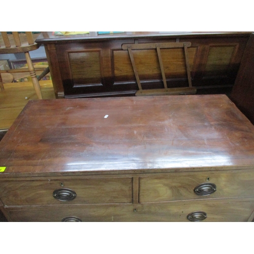 136 - A late George III mahogany flat fronted chest of two short and three long graduated drawers on splay... 