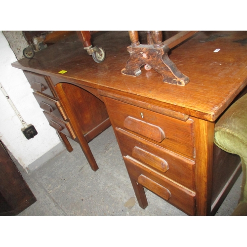 142 - An Early to mid 20th century oak pedestal desk with six pedestal drawers on square legs, 76cm x 122c... 