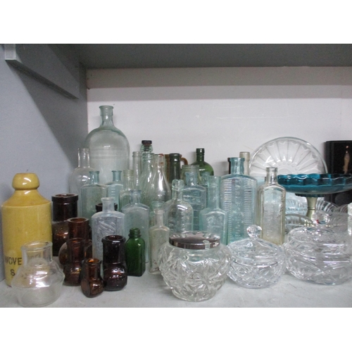 146 - A selection of glassware, bottles including some stoneware examples, a dressing table tray, and othe... 