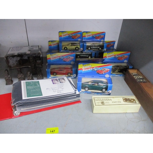 147 - A mixed lot to include an album of First Day covers, nine boxed Super Racer diecast model cars, boxe... 