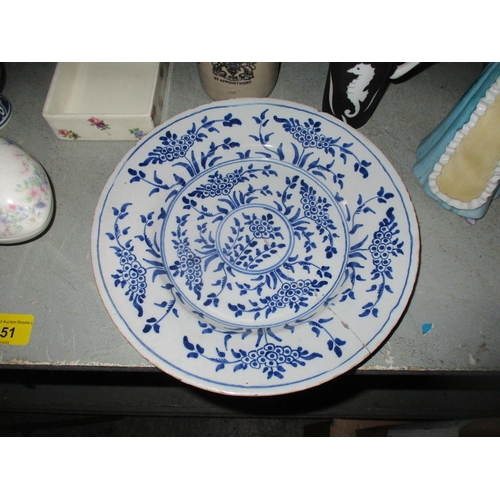 151 - A mixed lot of ceramics to include a 19th century Dutch pottery charger, 18th century Delft pottery ... 